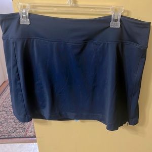 Champion skorts Navy/light blue(underneath) with zipper up the leg.  Size L